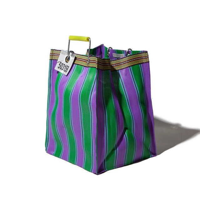Striped bag with green and purple pattern on a white background
